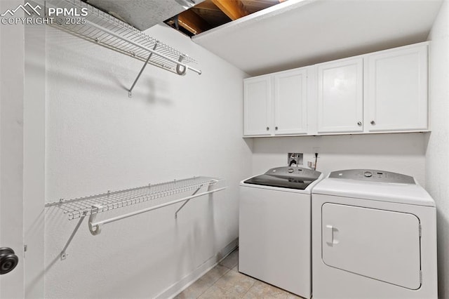 1107 Parkview Blvd, Colorado Springs, CO 80905 - laundry area featuring cabinet space, washer and clothes dryer, and light tile patterned floors