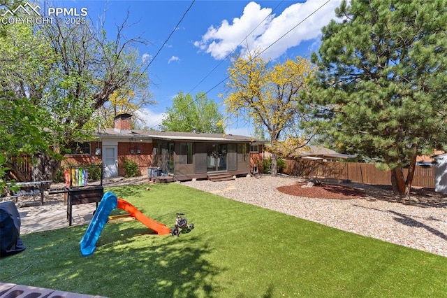 1107 Parkview Blvd, Colorado Springs, CO 80905 - back of house featuring a sunroom and a chimney