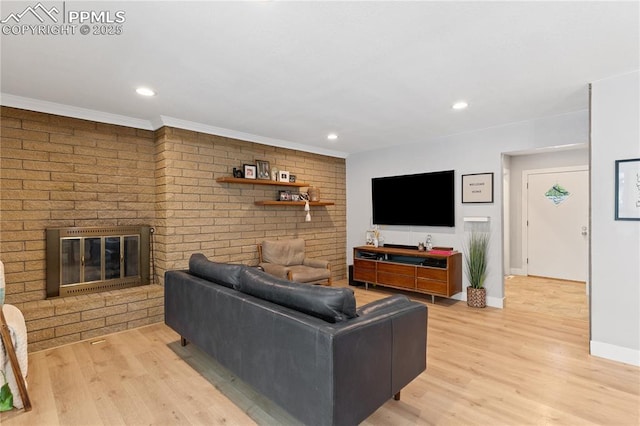 1107 Parkview Blvd, Colorado Springs, CO 80905 - living area featuring baseboards, light wood finished floors, a fireplace, crown molding, and recessed lighting