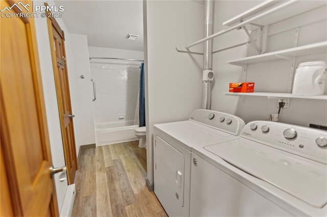 867 Twin Lakes Dr, Divide, CO 80814 - clothes washing area featuring independent washer and dryer and light wood-style floors