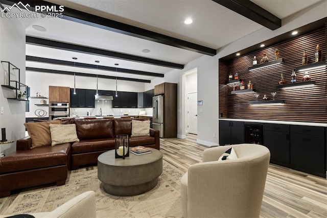 16244 Thunder Cat Way, Monument, CO 80132 - living room with light wood-style floors, beverage cooler, wet bar, recessed lighting, and baseboards