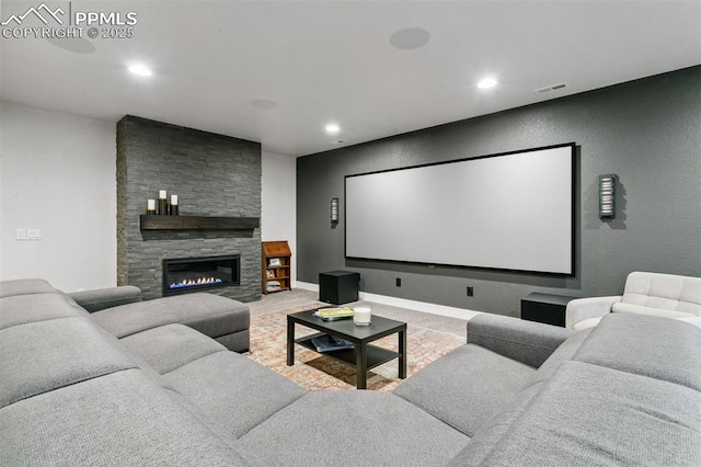 16244 Thunder Cat Way, Monument, CO 80132 - carpeted home theater with recessed lighting, a stone fireplace, and baseboards