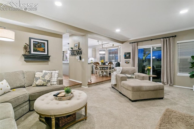 9131 Estebury Cir, Colorado Springs, CO 80920 - living room with ornamental molding, baseboards, light colored carpet, and recessed lighting