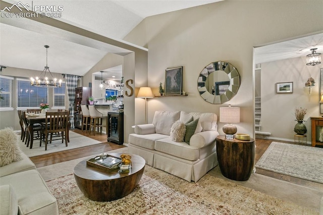 9131 Estebury Cir, Colorado Springs, CO 80920 - living area with a chandelier, lofted ceiling, wood finished floors, and baseboards