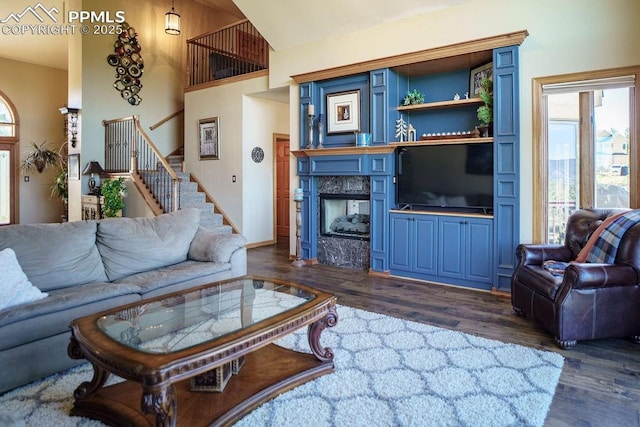 1120 Brenthaven Ct, Monument, CO 80132 - living room with dark wood-type flooring and stairway