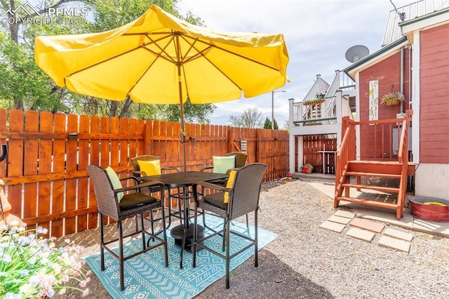 521 W Corona Ave, Pueblo, CO 81004 - view of patio / terrace with a fenced backyard and outdoor dining area