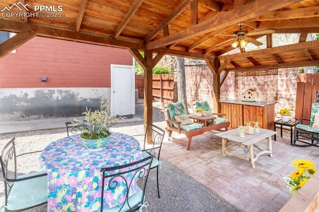 521 W Corona Ave, Pueblo, CO 81004 - view of patio featuring fence, a gazebo, outdoor dining space, and a ceiling fan