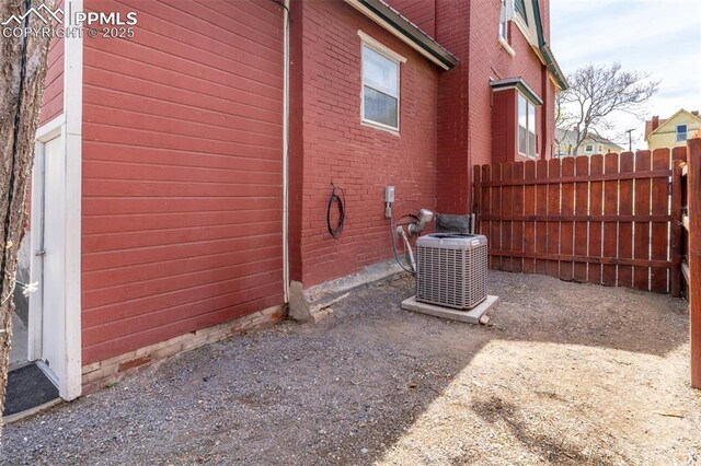 521 W Corona Ave, Pueblo, CO 81004 - view of property exterior with fence and central AC unit