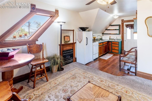 521 W Corona Ave, Pueblo, CO 81004 - sitting room with ceiling fan, dark wood-style flooring, and lofted ceiling