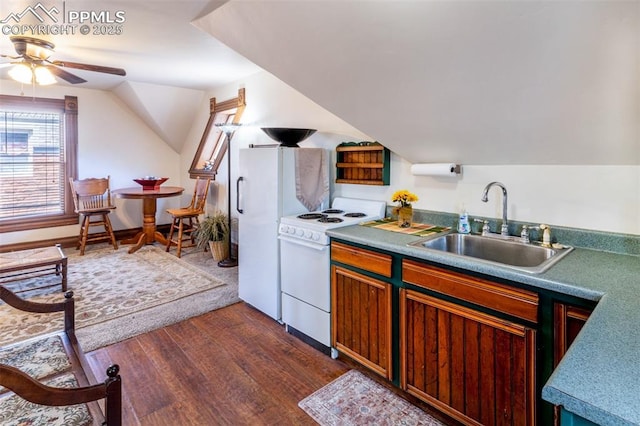 521 W Corona Ave, Pueblo, CO 81004 - kitchen featuring white appliances, a sink, a ceiling fan, dark wood-type flooring, and lofted ceiling