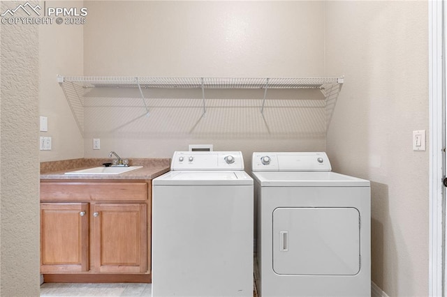 1076 Rosemary St, Denver, CO 80230 - washroom with separate washer and dryer and cabinet space
