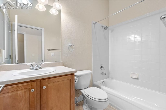 1076 Rosemary St, Denver, CO 80230 - full bathroom with a textured wall, toilet, vanity, and washtub / shower combination