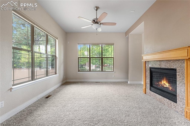 1076 Rosemary St, Denver, CO 80230 - unfurnished living room featuring ceiling fan, a fireplace, baseboards, and carpet