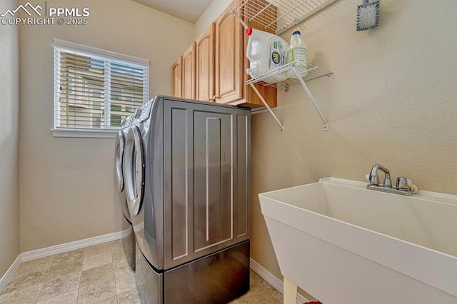 261 Saber Creek Dr, Monument, CO 80132 - washroom with independent washer and dryer, cabinet space, and baseboards