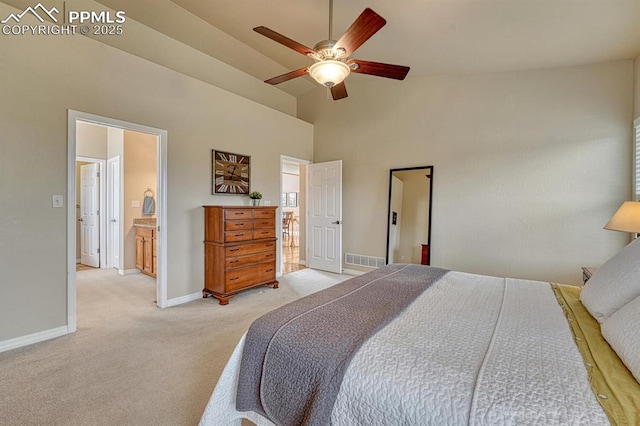 261 Saber Creek Dr, Monument, CO 80132 - bedroom with light carpet, high vaulted ceiling, baseboards, a ceiling fan, and ensuite bath