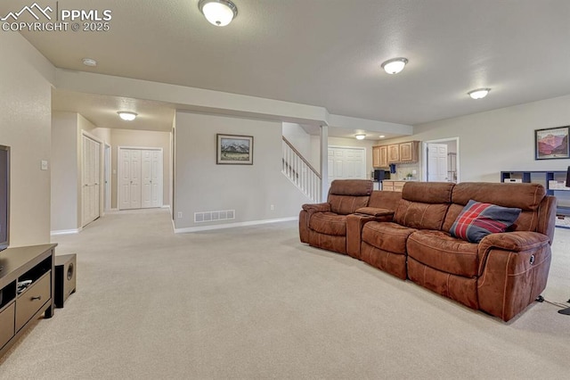 261 Saber Creek Dr, Monument, CO 80132 - living area featuring light carpet, stairway, and baseboards