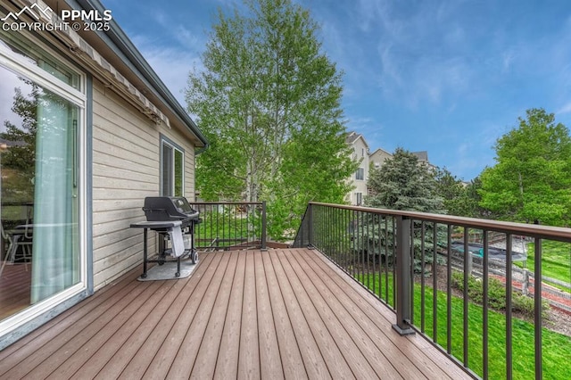 261 Saber Creek Dr, Monument, CO 80132 - wooden deck with a grill