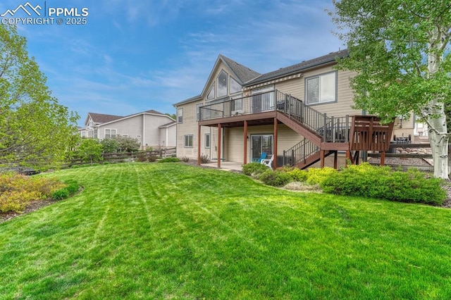 261 Saber Creek Dr, Monument, CO 80132 - back of property with a deck, stairs, and a patio