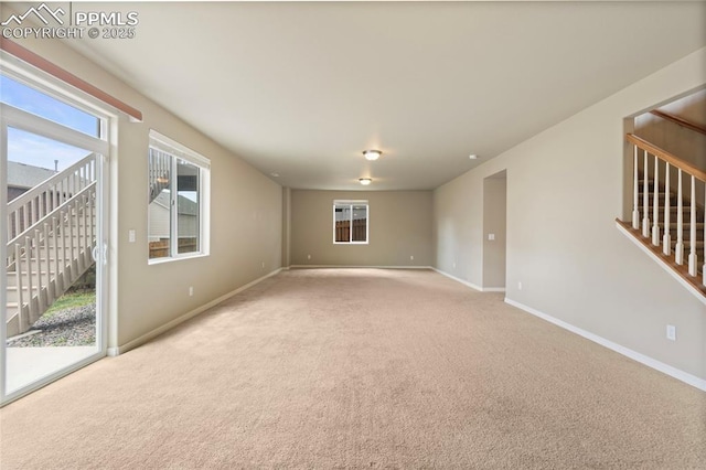 7031 Thorn Brush Way, Colorado Springs, CO 80923 - spare room with carpet flooring, stairs, and baseboards