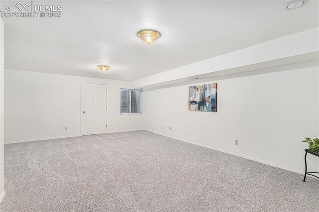 480 W Rockrimmon Blvd Unit D, Colorado Springs, CO 80919 - carpeted empty room with baseboards and a textured ceiling
