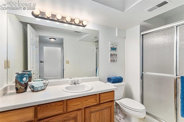 480 W Rockrimmon Blvd Unit D, Colorado Springs, CO 80919 - full bath with a shower stall, toilet, and vanity