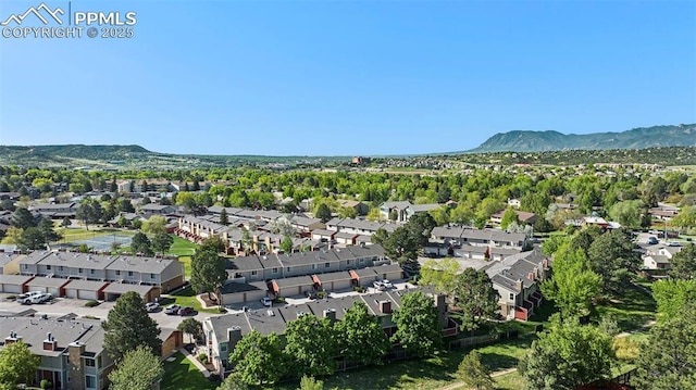 480 W Rockrimmon Blvd Unit D, Colorado Springs, CO 80919 - aerial view of property and surrounding area featuring a mountain backdrop and nearby suburban area