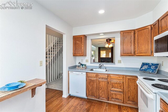 480 W Rockrimmon Blvd Unit D, Colorado Springs, CO 80919 - kitchen with white appliances, a sink, dark wood finished floors, brown cabinetry, and a ceiling fan