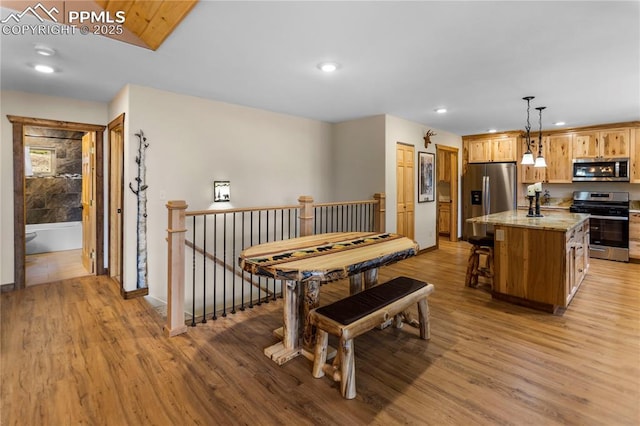 74 Buckskin Cir, Florissant, CO 80816 - dining space with light wood finished floors, recessed lighting, and baseboards