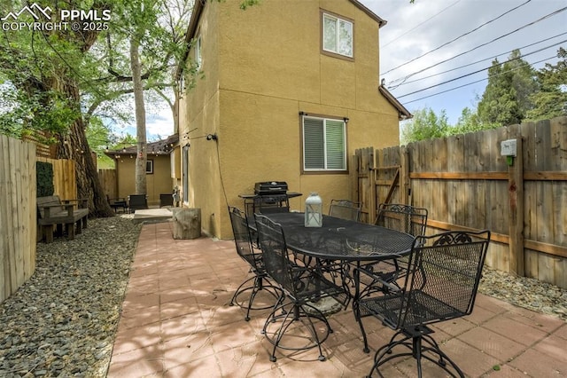111 N 14th St, Colorado Springs, CO 80904 - view of patio / terrace featuring a fenced backyard and outdoor dining area