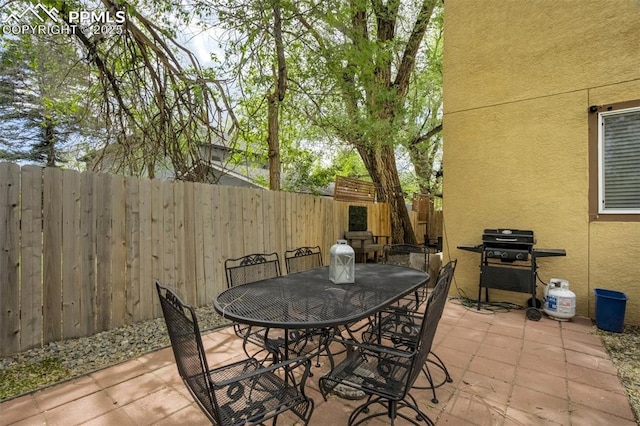 111 N 14th St, Colorado Springs, CO 80904 - view of patio / terrace featuring a fenced backyard, outdoor dining space, and area for grilling