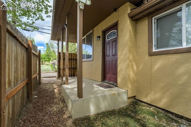 111 N 14th St, Colorado Springs, CO 80904 - entrance to property with stucco siding and fence