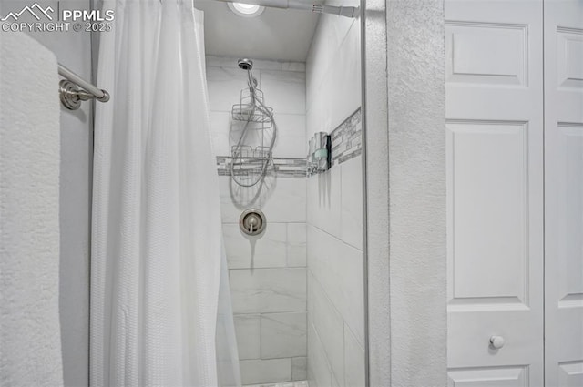 111 N 14th St, Colorado Springs, CO 80904 - full bath with tiled shower and a textured wall
