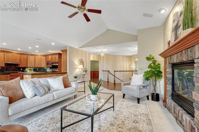 16150 Cliffrock Ct, Colorado Springs, CO 80921 - living room featuring a stone fireplace, a ceiling fan, recessed lighting, high vaulted ceiling, and light colored carpet
