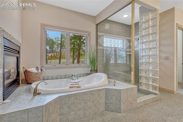16150 Cliffrock Ct, Colorado Springs, CO 80921 - full bathroom with plenty of natural light, a garden tub, and a tile shower