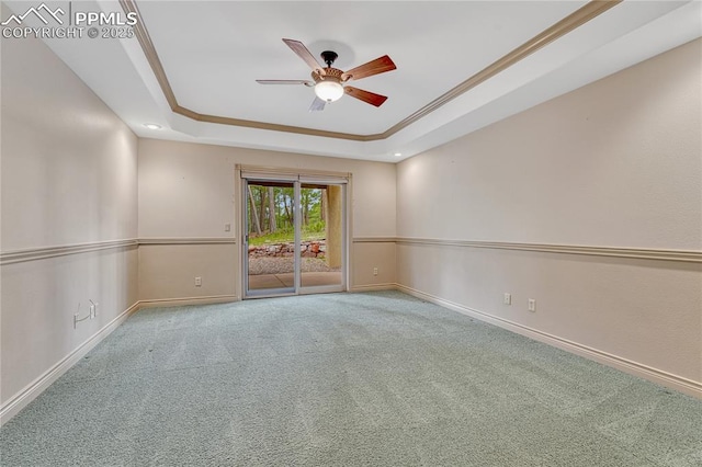 16150 Cliffrock Ct, Colorado Springs, CO 80921 - carpeted empty room featuring a raised ceiling, a ceiling fan, baseboards, and crown molding