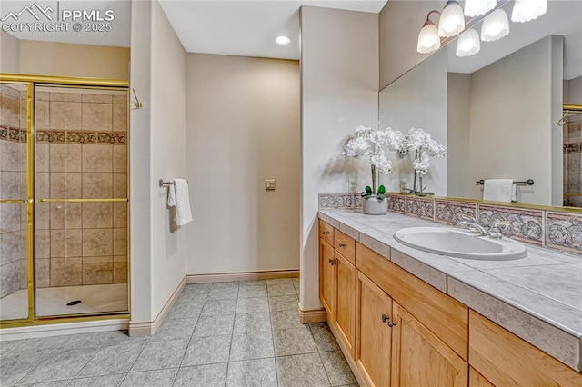 16150 Cliffrock Ct, Colorado Springs, CO 80921 - bathroom with a stall shower, baseboards, tile patterned flooring, and recessed lighting