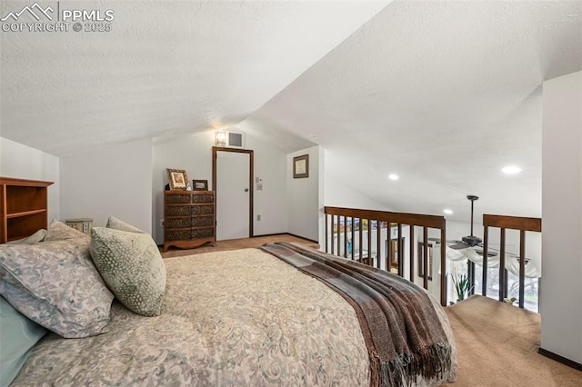 8020 Westwood Rd, Colorado Springs, CO 80919 - carpeted bedroom featuring vaulted ceiling, recessed lighting, and a textured ceiling