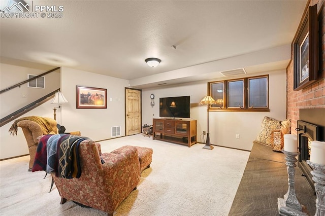 8020 Westwood Rd, Colorado Springs, CO 80919 - living area with light colored carpet, a fireplace, and baseboards