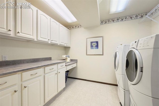 8020 Westwood Rd, Colorado Springs, CO 80919 - washroom featuring washing machine and clothes dryer, cabinet space, baseboards, and light floors