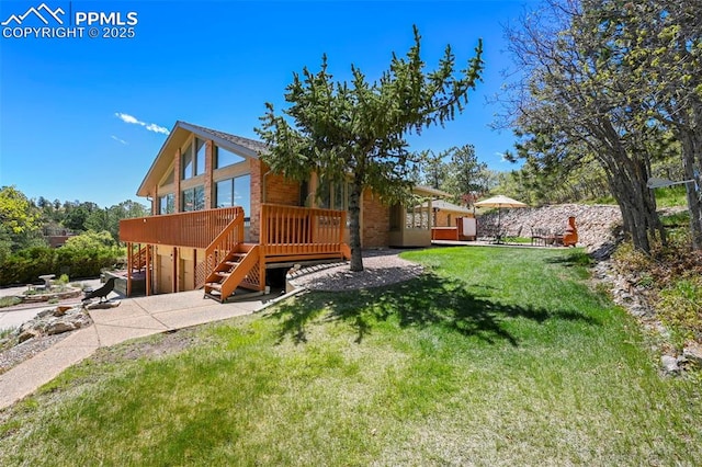 8020 Westwood Rd, Colorado Springs, CO 80919 - view of green lawn with a deck, a garage, concrete driveway, a patio area, and stairway
