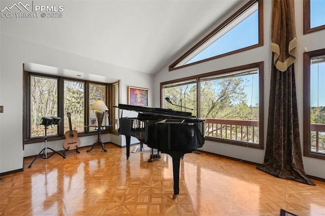 8020 Westwood Rd, Colorado Springs, CO 80919 - living area featuring high vaulted ceiling and baseboards