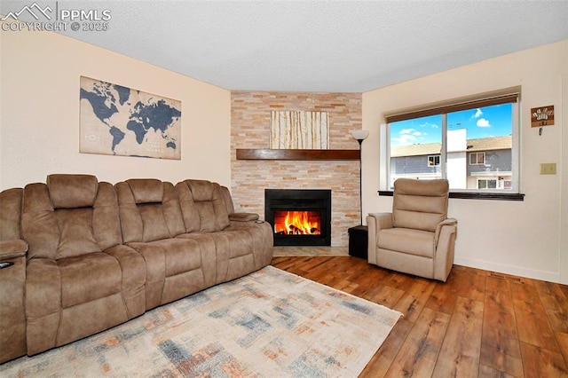 1234 Soaring Eagle Dr, Colorado Springs, CO 80915 - living room featuring hardwood / wood-style floors, a fireplace, and baseboards