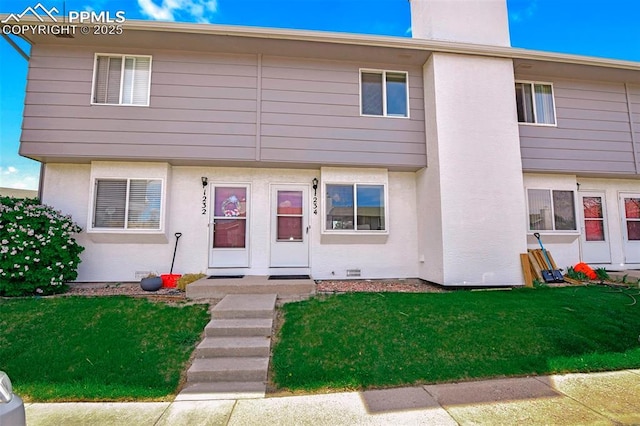 1234 Soaring Eagle Dr, Colorado Springs, CO 80915 - view of property featuring a chimney and a front yard