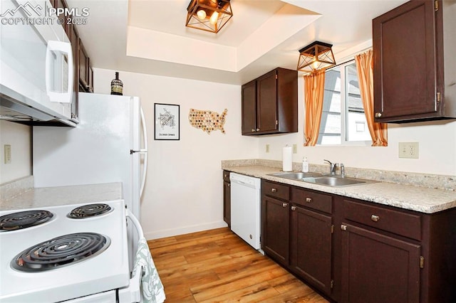 1234 Soaring Eagle Dr, Colorado Springs, CO 80915 - kitchen with white appliances, a sink, and dark brown cabinetry
