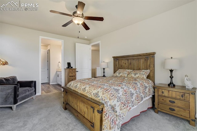 2062 Lone Willow Vw, Colorado Springs, CO 80904 - bedroom featuring light carpet, connected bathroom, a ceiling fan, and baseboards