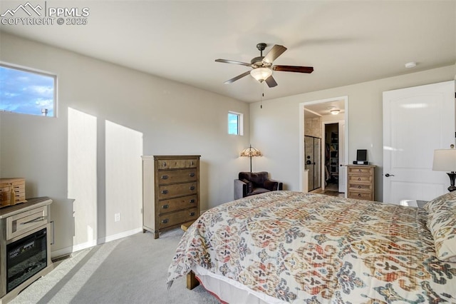 2062 Lone Willow Vw, Colorado Springs, CO 80904 - bedroom featuring a ceiling fan, light carpet, baseboards, and a walk in closet