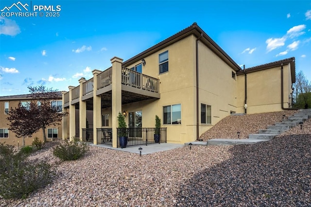 2062 Lone Willow Vw, Colorado Springs, CO 80904 - rear view of property with a patio and stucco siding