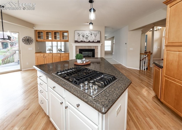12515 Broad Oaks Dr, Colorado Springs, CO 80921 - kitchen featuring stainless steel gas stovetop, light wood-type flooring, and plenty of natural light