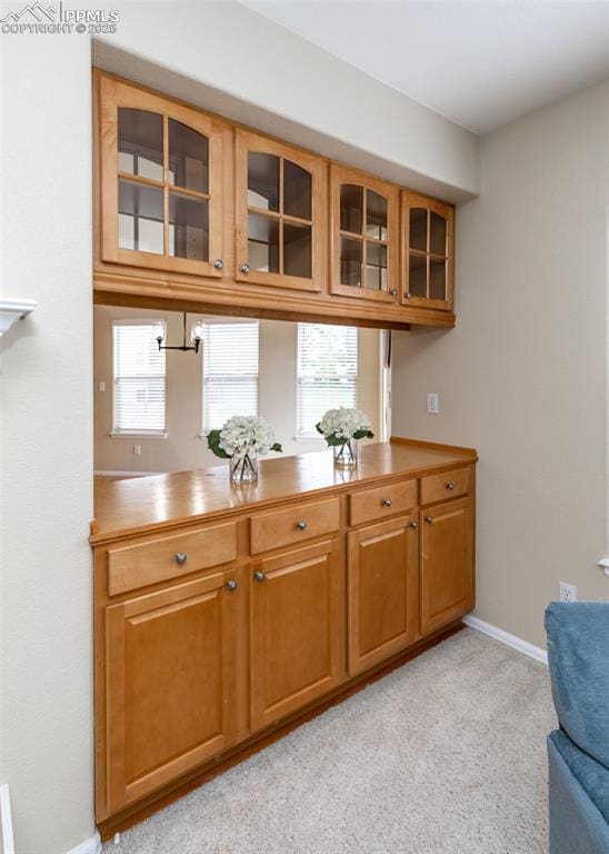 12515 Broad Oaks Dr, Colorado Springs, CO 80921 - bar area with light colored carpet and baseboards