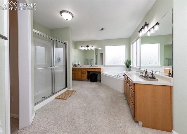 12515 Broad Oaks Dr, Colorado Springs, CO 80921 - bathroom featuring vanity, a shower stall, a bath, and carpet flooring